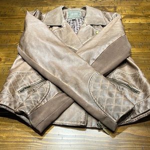 Maurice’s large light brown leather jacket